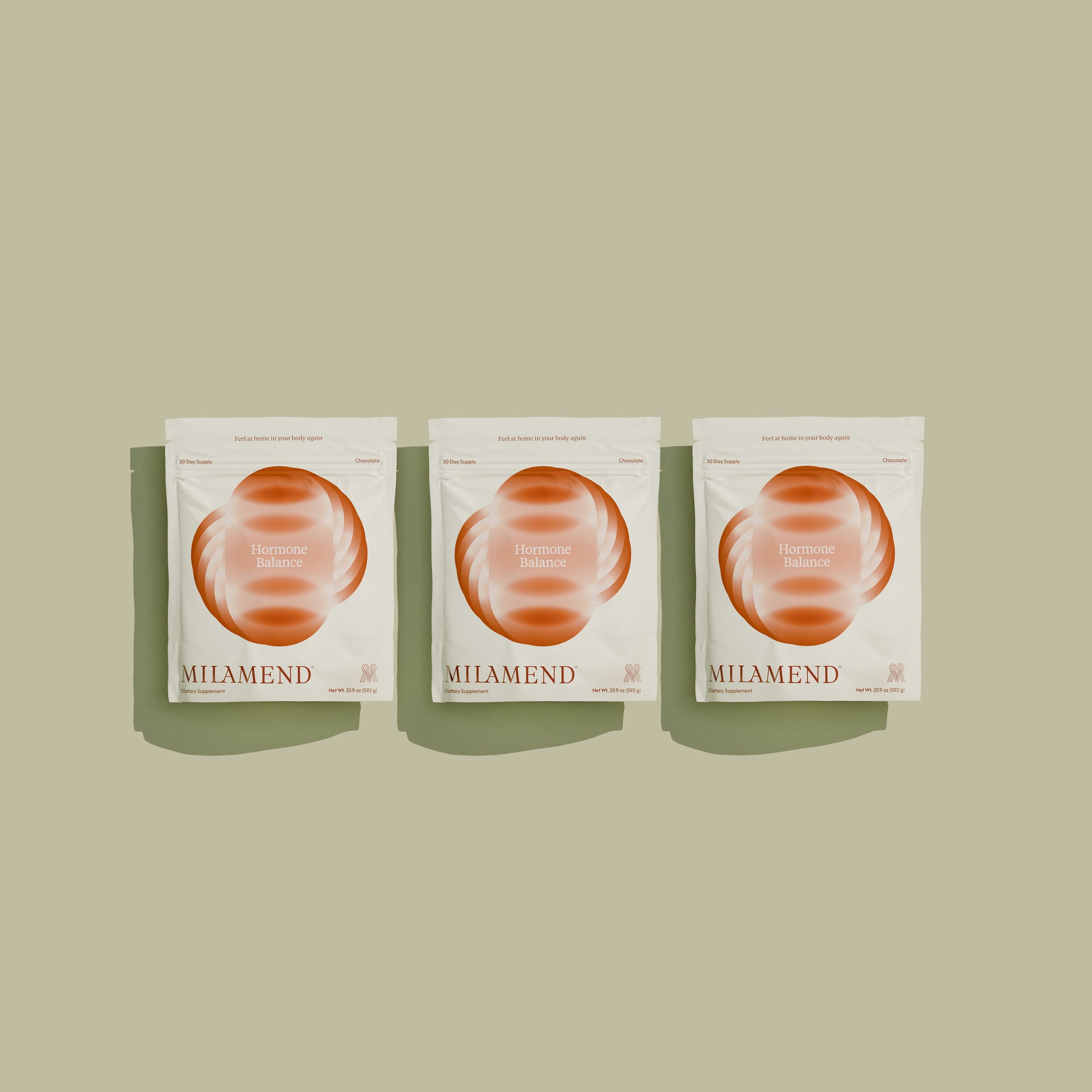Three Milamend skincare product packages on a beige background