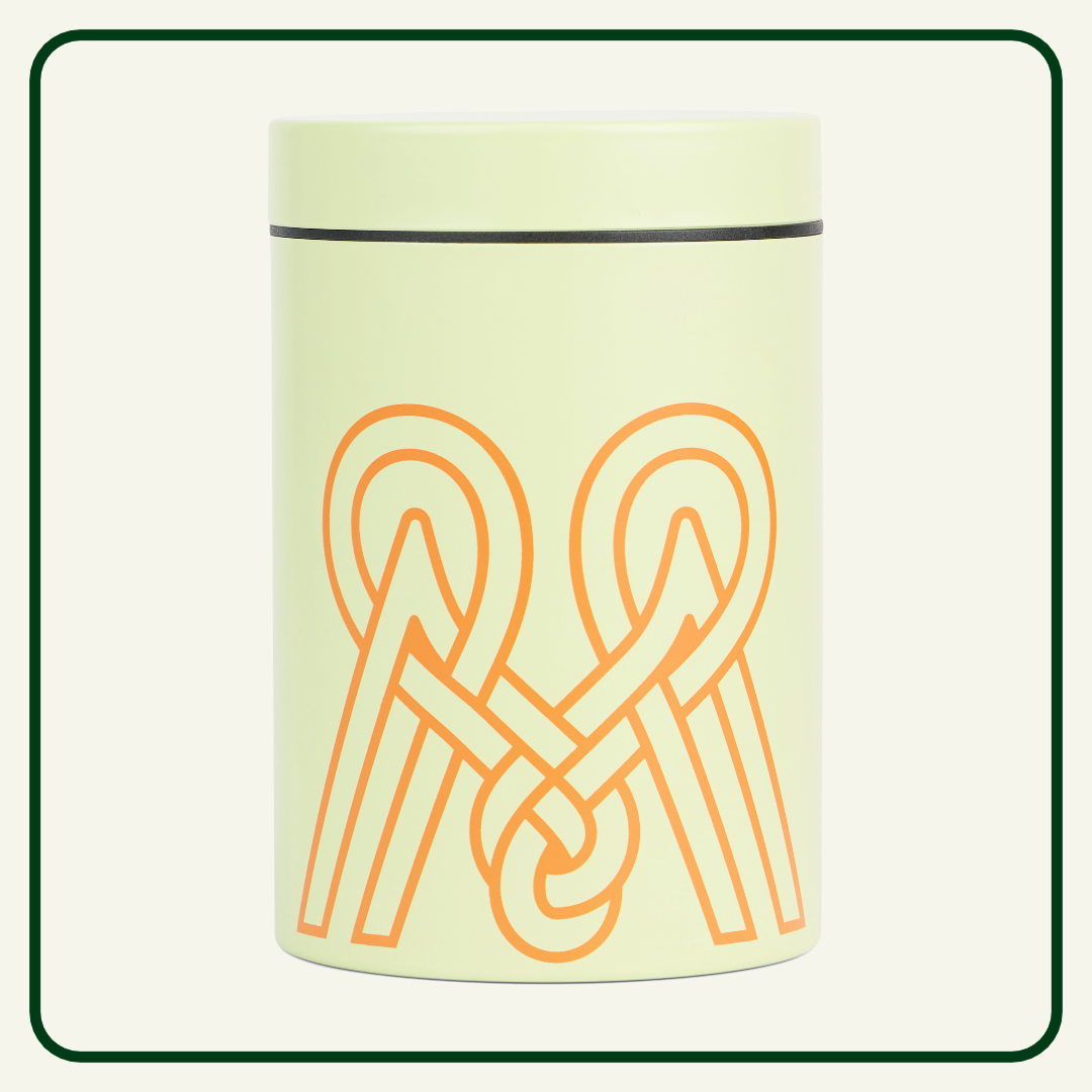 Light green cylindrical container with orange logo on a white background