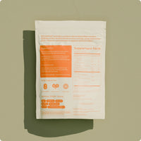 Supplement package with orange and beige design on a green background