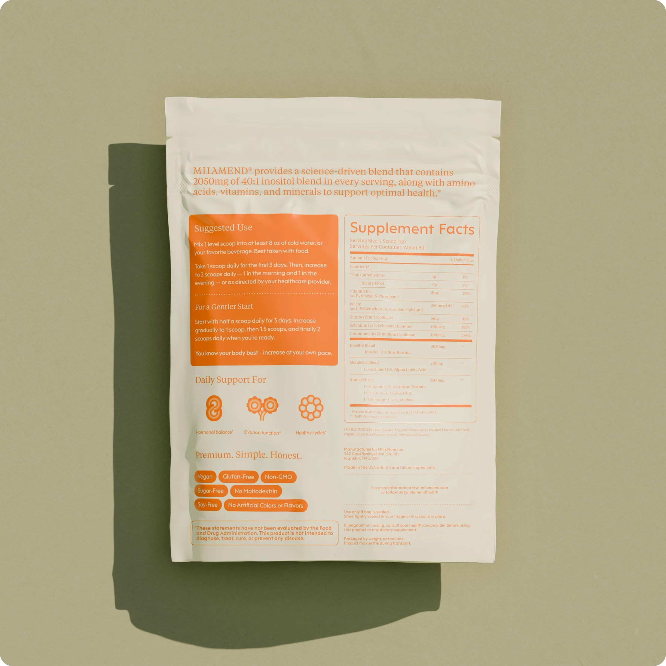 Supplement package with orange and beige design on a green background